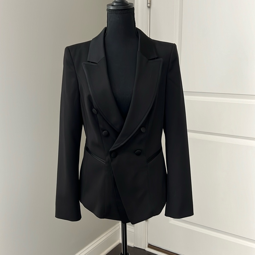 Never worn women’s tuxedo jacket with satin trim and collar.